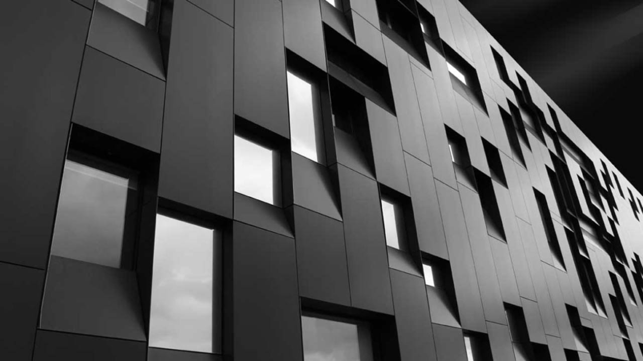 A low angle shot of a creative modern building with outstanding architectural twists